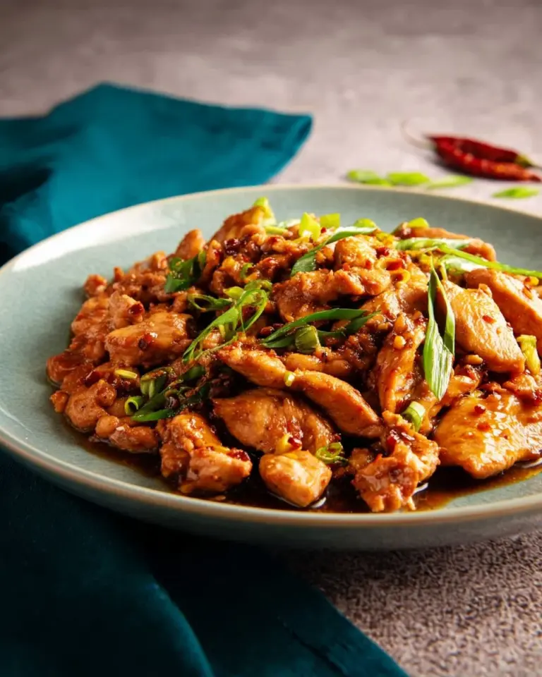 Delicious easy chili garlic chicken served on a plate with garnishes