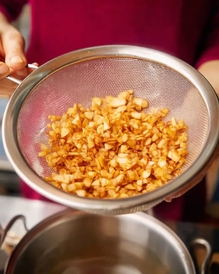 Homemade fried garlic and garlic oil in a glass jar for cooking.