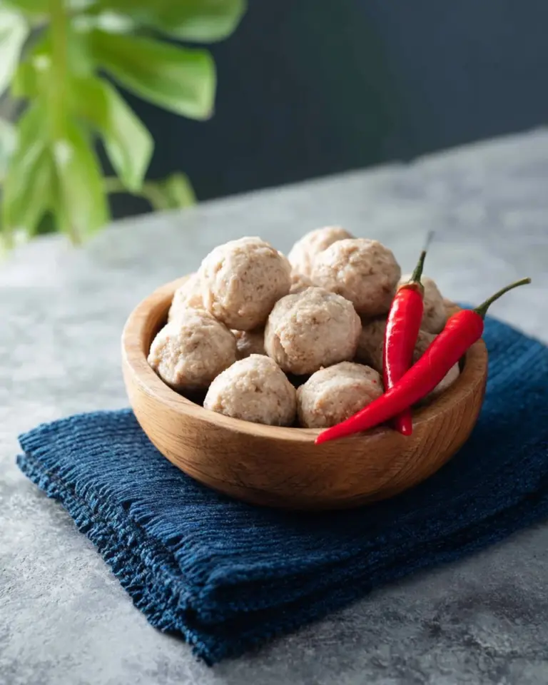 Delicious homemade pork meatballs garnished with herbs and spices.