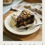 Delicious Butterfinger Bomb Cake topped with chocolate and Butterfinger pieces