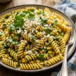 Bowl of colorful Mexican street corn pasta salad with fresh ingredients